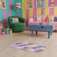 Rectangular geometric rug with scallop arcs in pink, blue, yellow, and cream.
