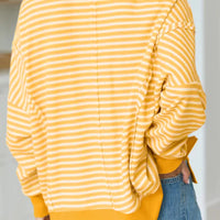 Yellow striped waffle-knit pullover with long sleeves and relaxed back silhouette