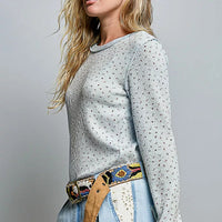 Light blue speckled knit crew neck long-sleeve top with ribbed cuffs