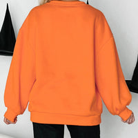 Orange sweatshirt back view with crewneck and long sleeves