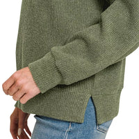 Dark olive ribbed sleeve cuff and textured knit fabric on hoodie