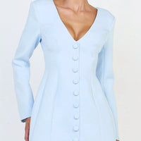 Light blue blazer dress with deep V-neck, long sleeves, and button-front