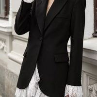 Black blazer with one button, lace-trim hem, and notched lapels