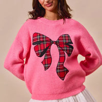 Pink crewneck sweater with plaid plaid-pattern ribbon bow at chest
