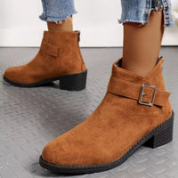 Brown suede point-toe block heel ankle boots with front strap and square buckle