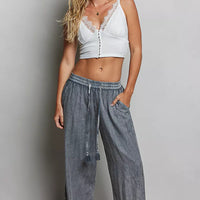 Charcoal drawstring wide-leg woven pants with elastic waist and side tassel