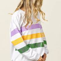 White sequin striped sweatshirt, back view with purple, yellow, and green bands