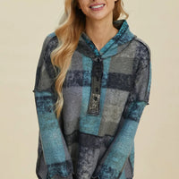 Plaid fleece hoodie with dropped shoulders, front half-zip, hood, kangaroo pocket, front view.