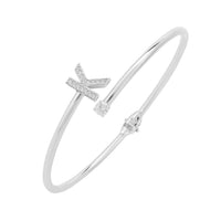 Silver bangle bracelet with K initial charm and small crystal accents.