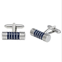 Cylindrical silver cufflinks with blue and black enamel ribbed design