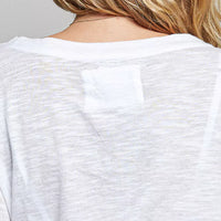 Off-white lightweight knit long-sleeve top with plain back panel
