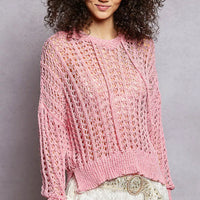Pink openwork knit top with round neck and long sleeves, high-low hem