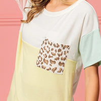 Color block crew neck top with leopard print chest pocket and mint side sleeve panel