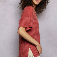 Terra cotta ribbed knit V-neck t-shirt with short sleeves and visible side slit
