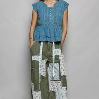 Denim blue sleeveless embroidered pintuck peplum blouse with button front