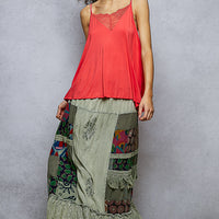 Sage patchwork ruffled skirt with multicolor side panels and lace-trim hem
