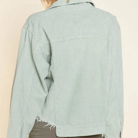 Sage corduroy trucker jacket back view with button-up yoke and frayed hem and cuffs