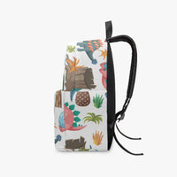 Kids dinosaur backpack side view with multicolor prehistoric print, black handle and zipper top