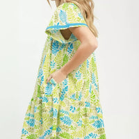 Green and blue leaf print tiered mini dress with flutter sleeves, side view