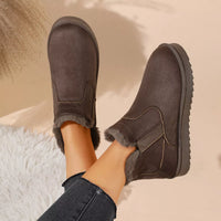 Dark brown plush-lined ankle boots with rounded toe and rugged tread sole