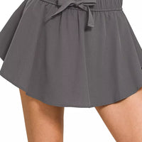 Ash grey woven active skort with elastic waistband and tie-front bow