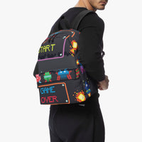 Kids canvas backpack on wearer, black with pixel “START” and “GAME OVER” graphic.