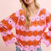 Orange crochet knit top with pink floral lace pattern, long sleeves, scoop neckline.