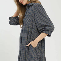 Navy plaid oversized shirt dress with short sleeves and front button closure