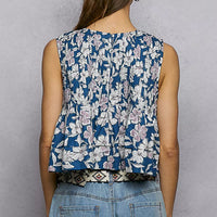 Navy floral sleeveless cropped tank, back view, with gathered pintuck seams