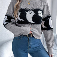 Gray crewneck sweater with ghost graphic panel, textured knit, and contrast cuff stripes