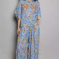 Blue floral printed woven shirt with ruffle sleeves and elastic waist, front full view