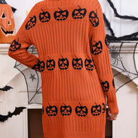 Orange open-front knit cardigan with black jack-o'-lantern motif print, full back