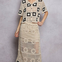 Crochet maxi skirt with ruffled waist and black granny-square motifs on the hem