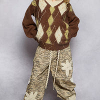 Women's mohair V-neck argyle sweater in brown with cream diamond pattern and contrast seams