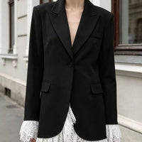 Black one-button blazer with lace-trim hem and two flap pockets