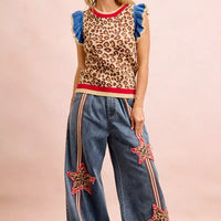 Leopard print knit sleeveless top with blue ruffle shoulder details and red trim
