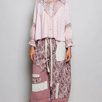 Rose pink lace-detail peasant blouse with long ruffled sleeves and gathered neckline