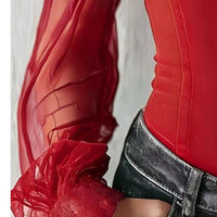 Red velvet blouse with lace cuff detailing on sheer sleeves and fitted bodice