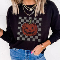 Black long sleeve sweatshirt with rhinestone pumpkin checkerboard front detail