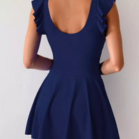 Royal blue ruffled-sleeve swim dress from back view, ruched waist, flared skirt with slit.