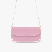 Pastel pink crossbody bag with front flap, gold chain strap, and white web handles