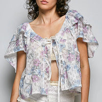 Floral tie-front ruffle blouse with lace trim, off-white and pastel purple/blue print