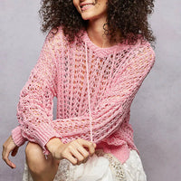Pink openwork knit top with round neck and long sleeves, relaxed fit
