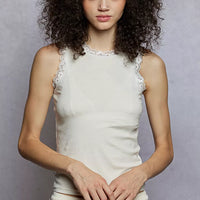 Cream round-neck cropped tank with scalloped lace trim at neckline and armholes