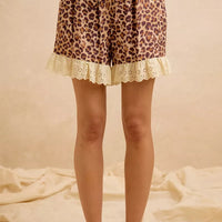 Leopard print shorts with drawstring waist and scalloped eyelet lace hem