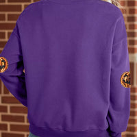 Violet Halloween sweatshirt back view with pumpkin sequin patches