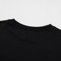 Black crewneck sweatshirt neckline ribbing close-up