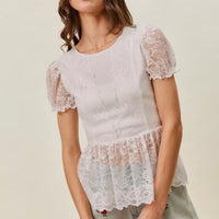 Light-wash denim shorts with rose embroidery shown on model