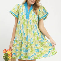 Green and blue leaf print tiered mini dress with flutter sleeves and V-neck