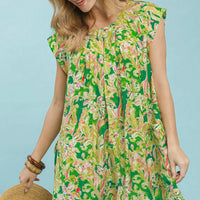 Green tropical floral swing dress with flutter sleeves and round neckline, side view